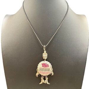 Fantabulous Vintage Tab Man Necklace.